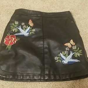 Leather skirt with patches